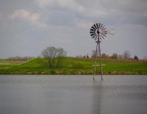 Windmill in the middle of a pond in Iowa